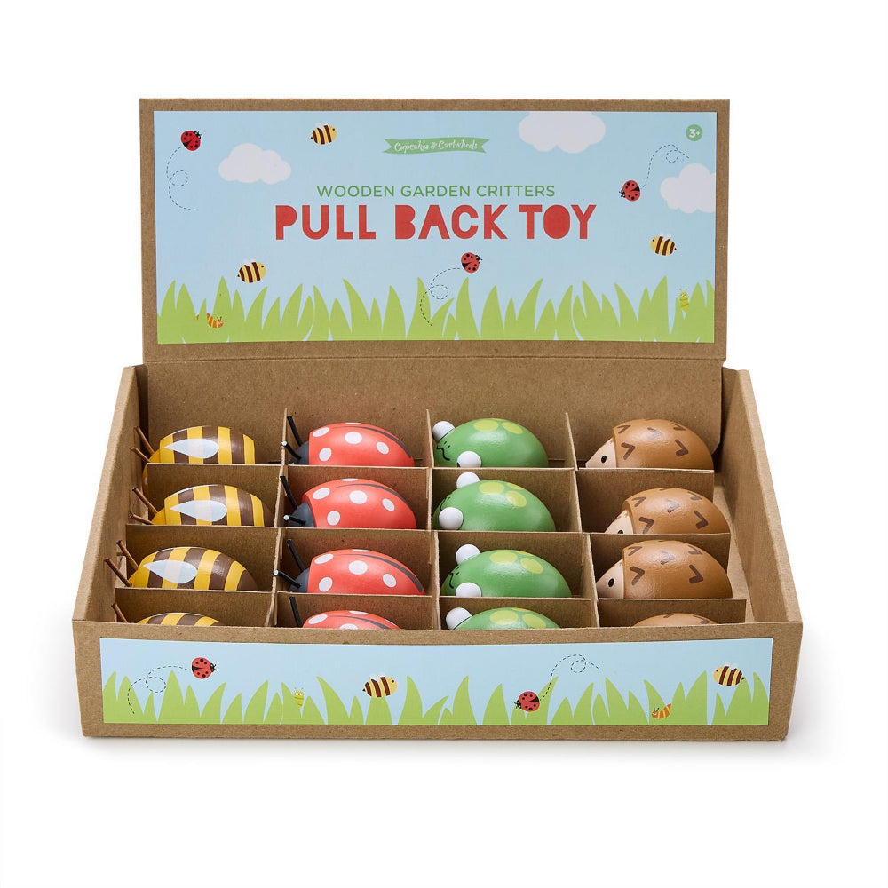 Box of wooden  toys with colorful designs on a white background.