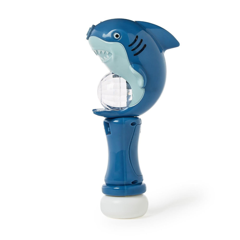 Shark-shaped bubble machine on a white background.