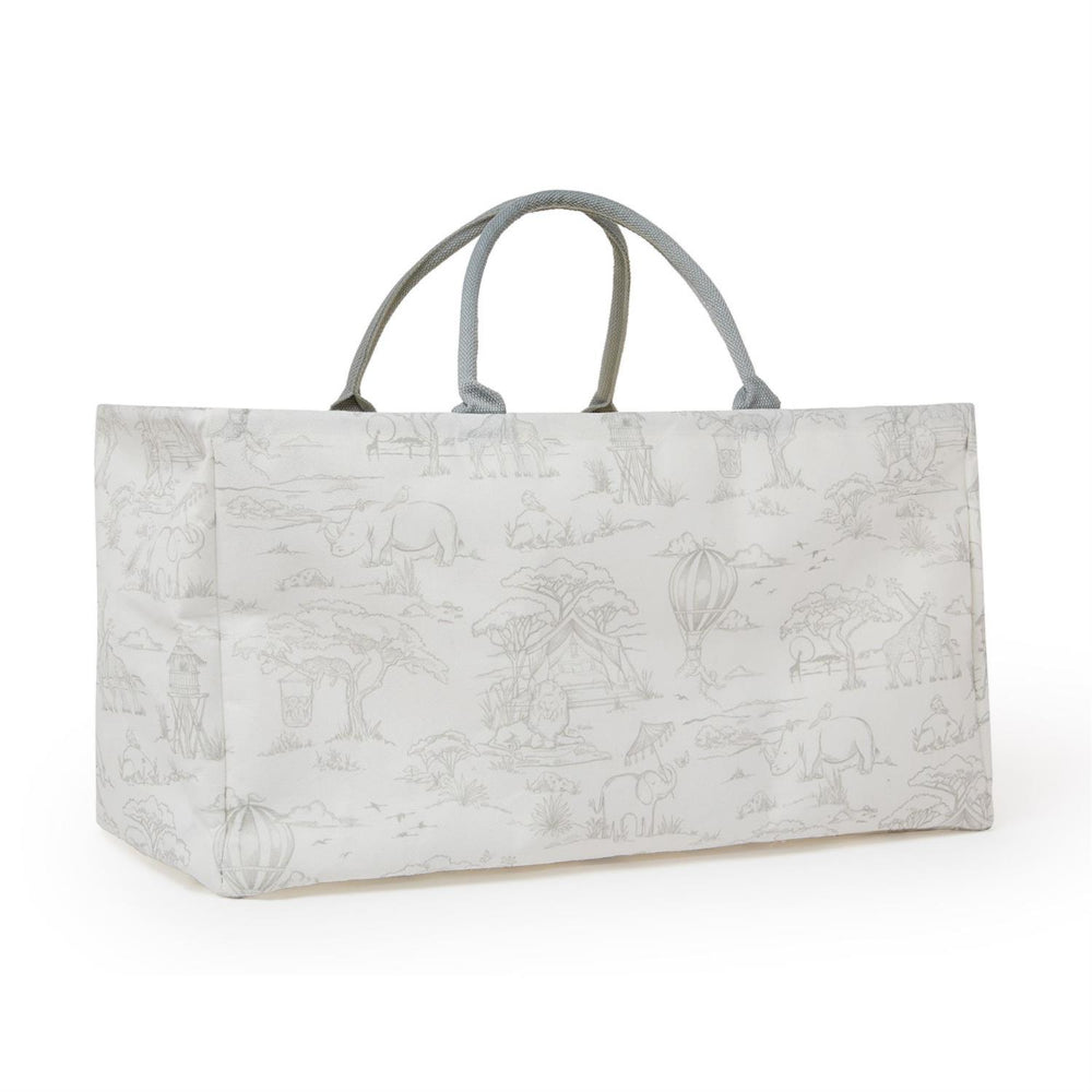An angled side of a grey safari patterned bag on white with a handle on a white background