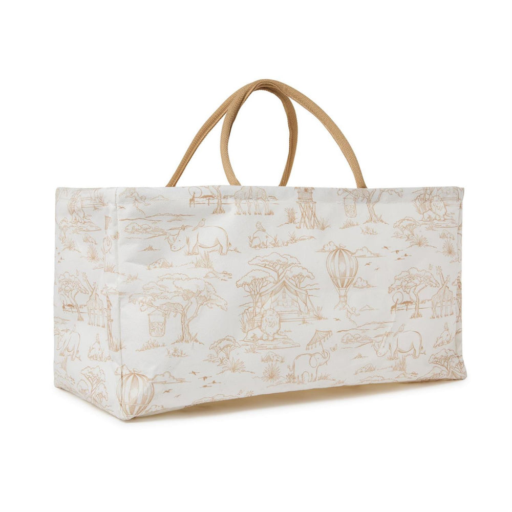 An angled side of a taupe safari patterned bag on white with a handle on a white background