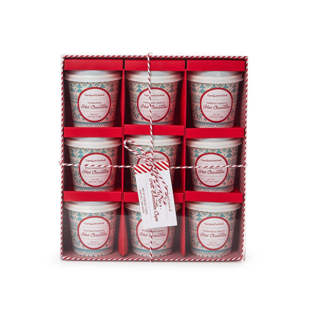 A set of nine hot chocolate cups in gift box on a white backround 