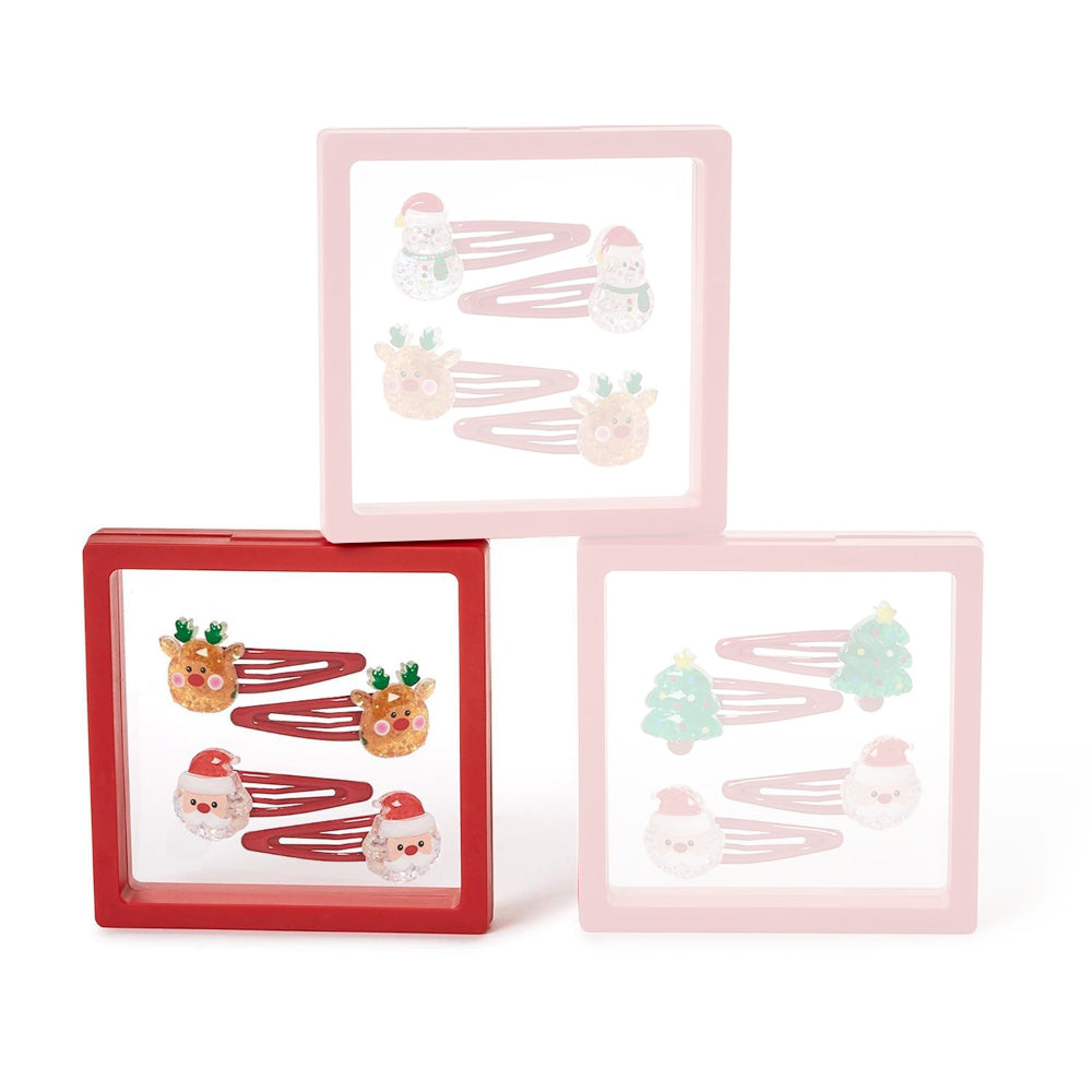Set of four christmas-themed raindeer & santa hair clips in clear packaging with a red boarder on a white background.
