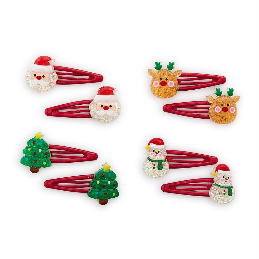 Four sets of christmas-themed hair clips Santa, reindeer, snowman and trees on a white background.