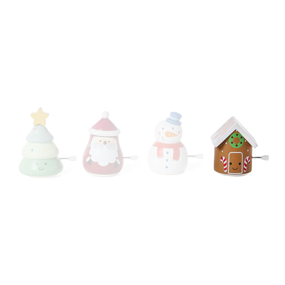 Gingerbread House wind up toy on a white backround. 