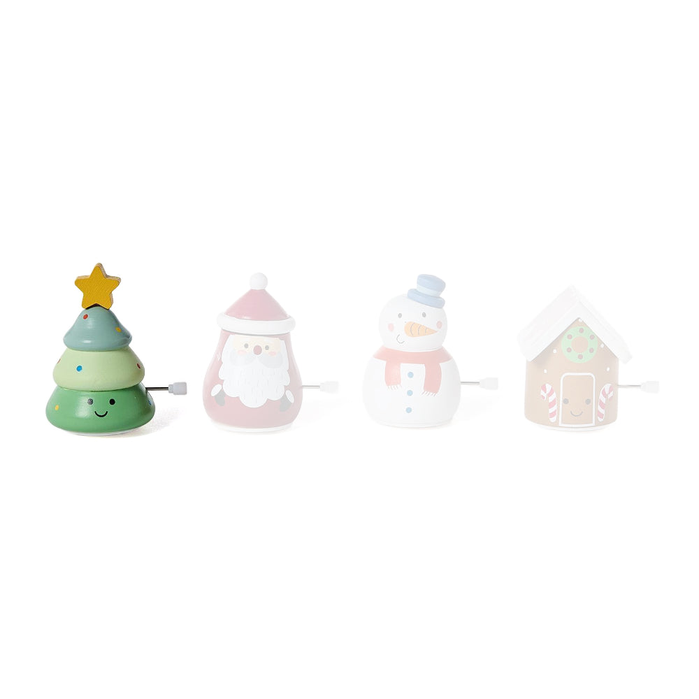 Green christmas tree wind up toy on a white backround. 