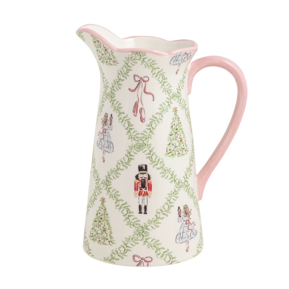 Decorative ceramic pitcher with Christmas-themed design on a white background