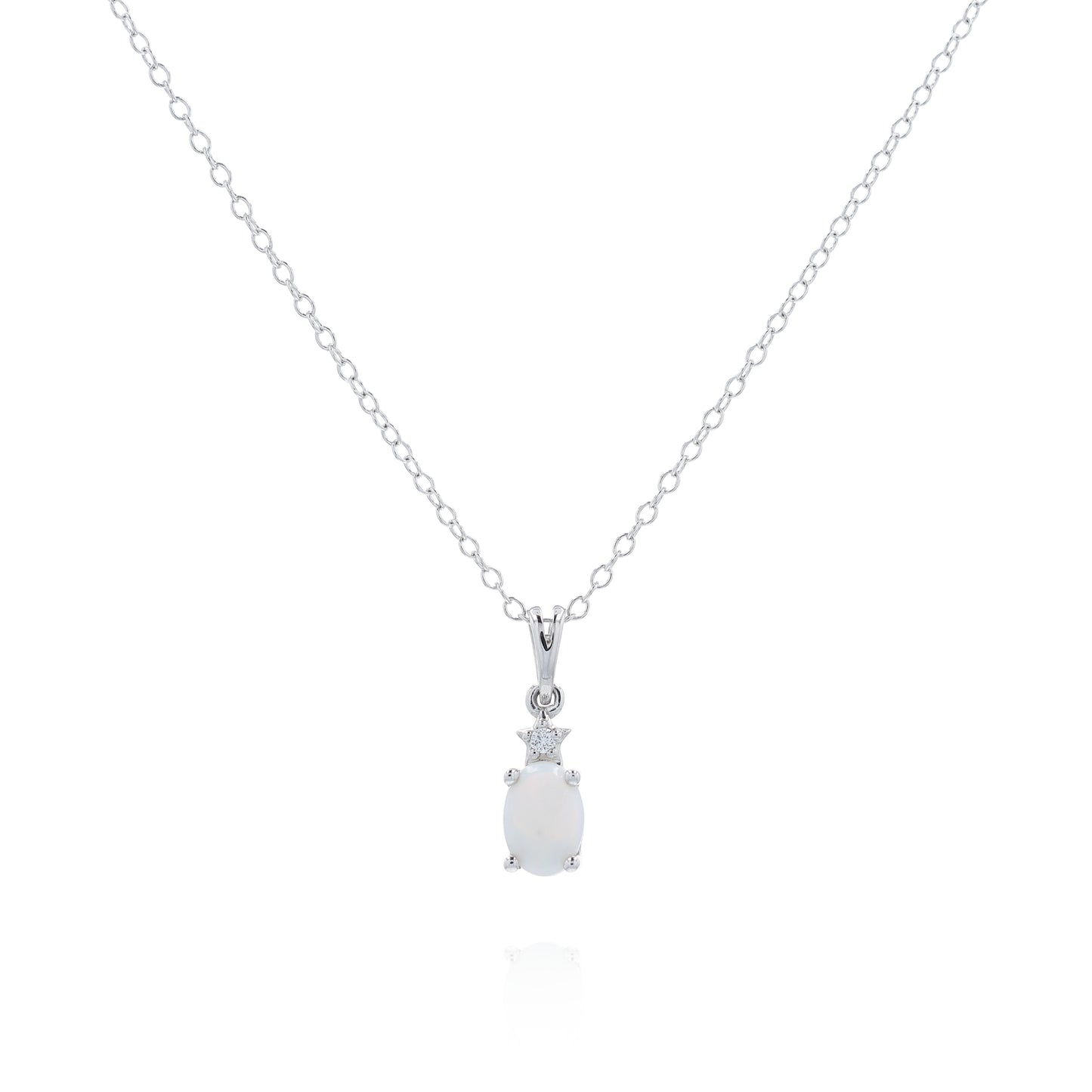 White gold oval opal and diamond pendant necklace on a white background