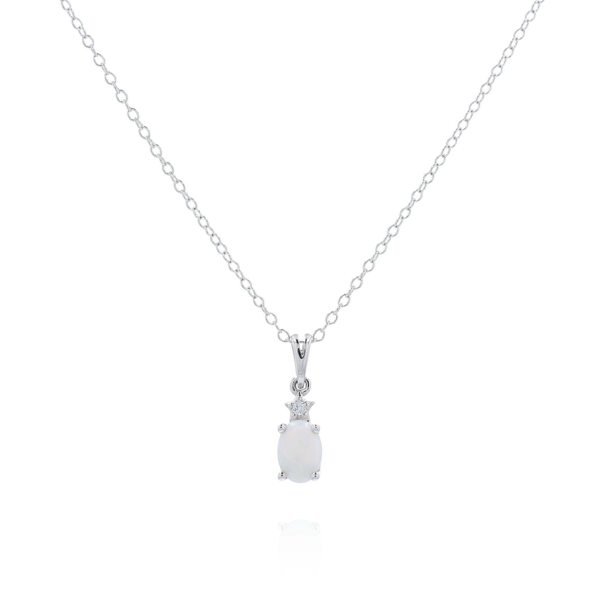 White gold oval opal and diamond pendant necklace on a white background