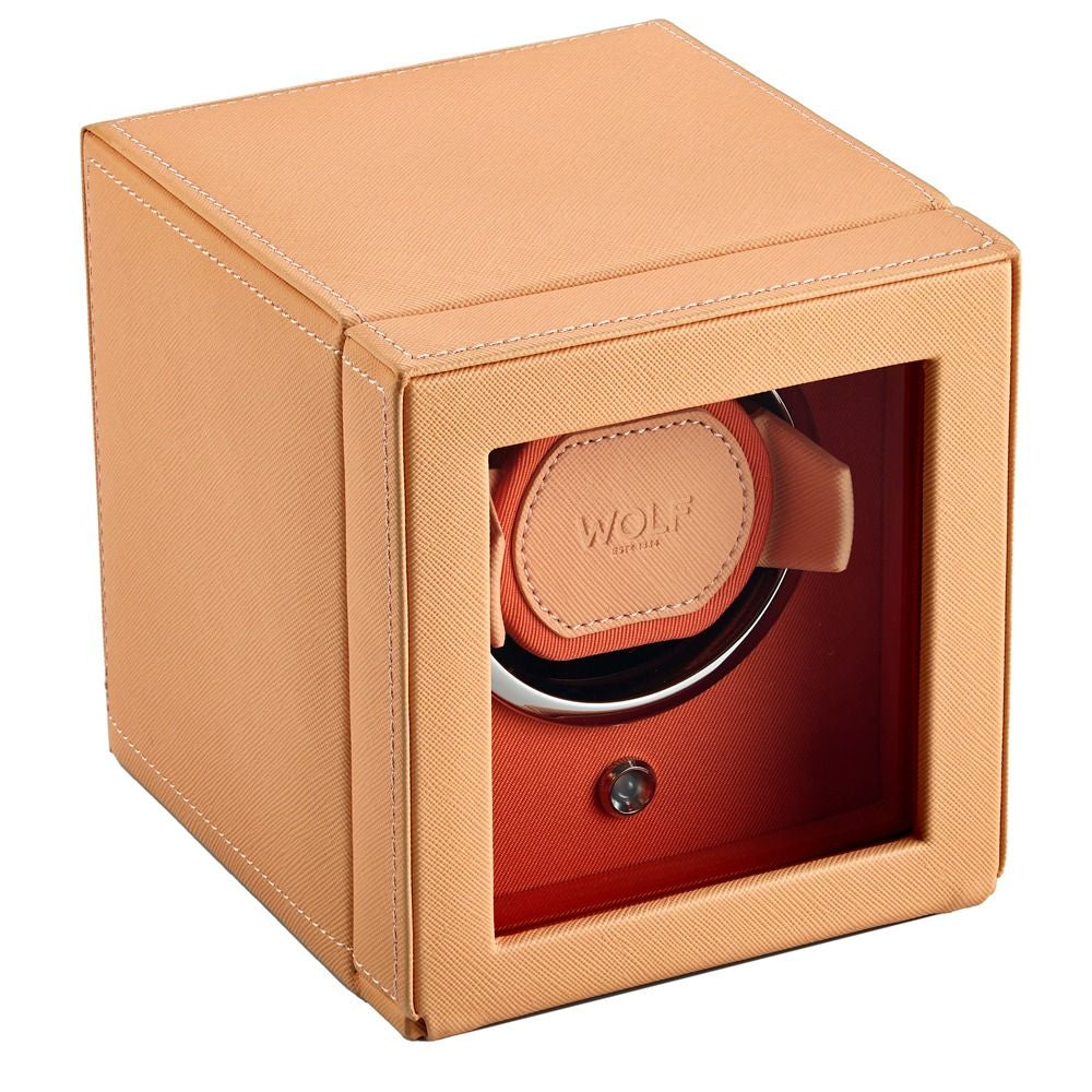 Beige watch winder with a visible brand logo on a white background