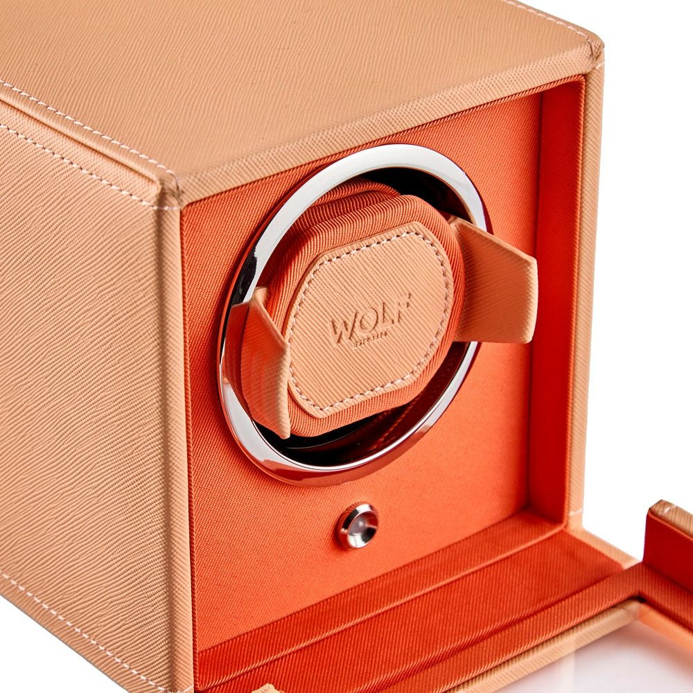 Orange watch winder with 'WOLF' branding on a white background