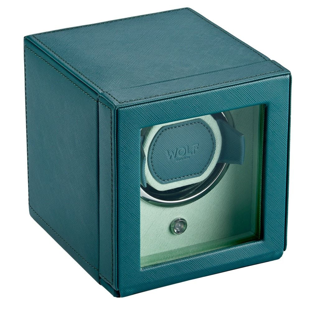 Teal watch winder with clear front panel on a white background