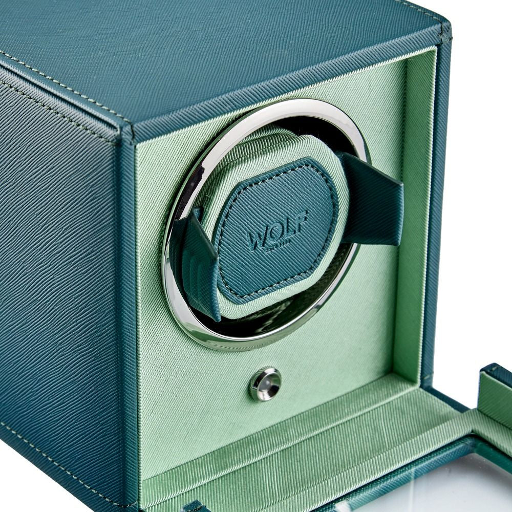 Green watch winder with WOLF branding on a white background