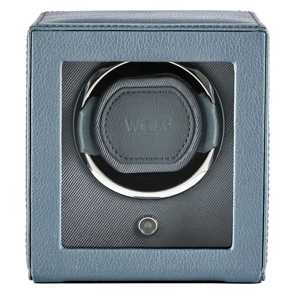 Watches winder with blue leather casing on a white background
