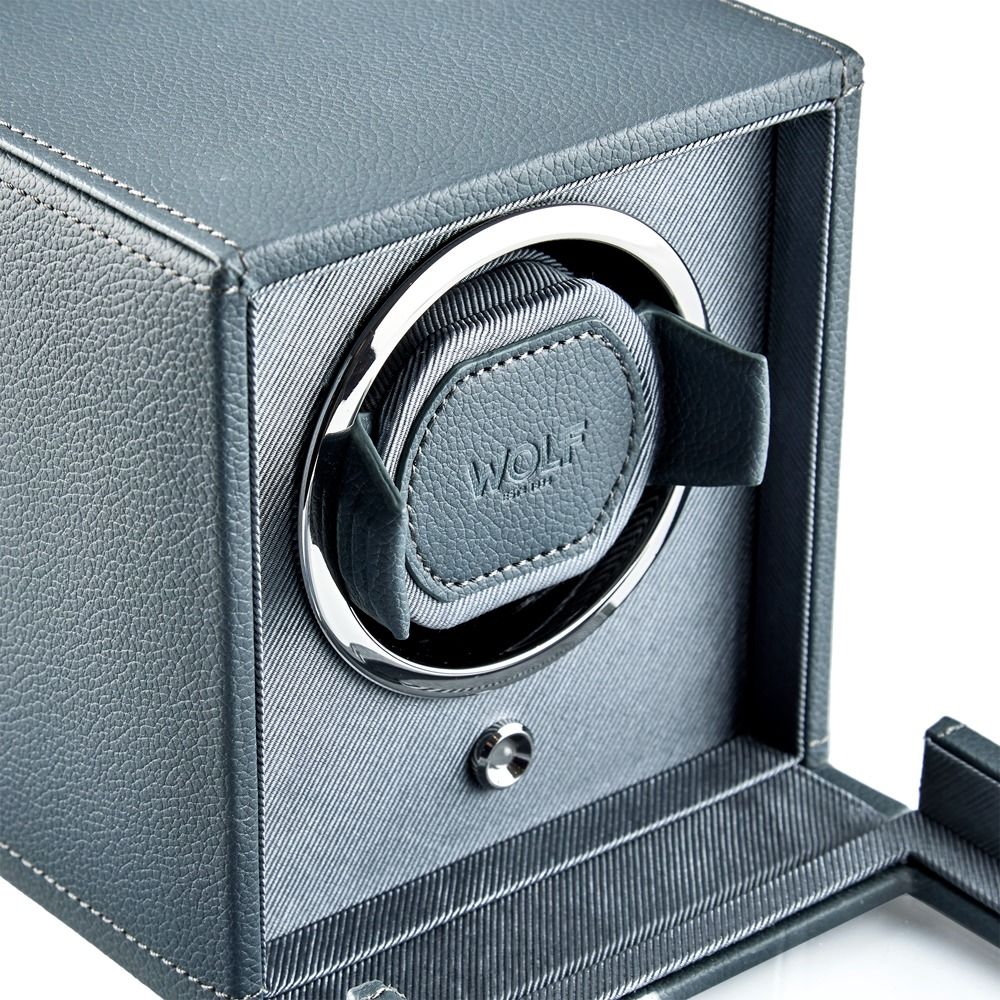 Wolf watch winder in a gray leather box on a white background