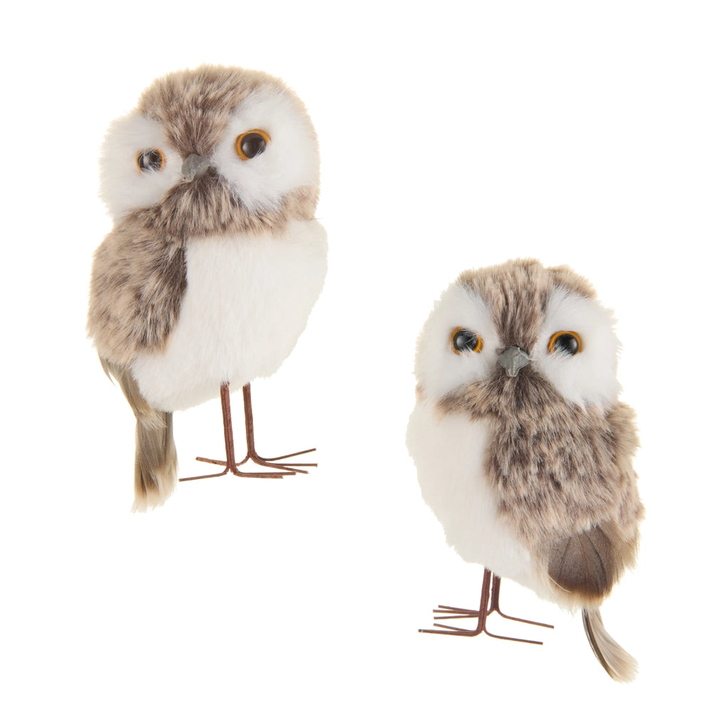Two plush owls on stands against a white background.