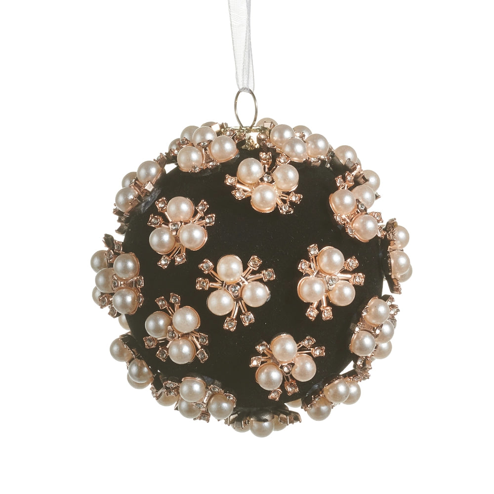 Decorative black ornament with pearls on a white background.
