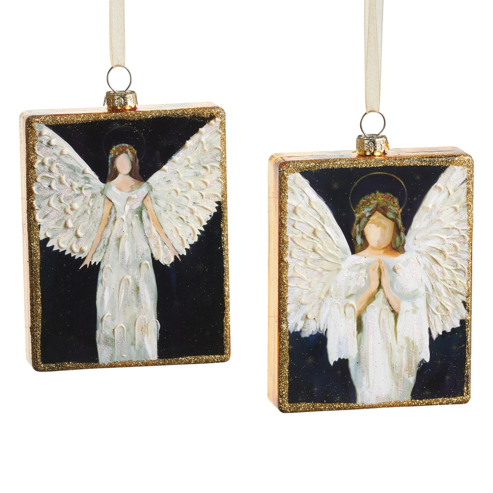 Two angel ornaments with gold frames on a white background