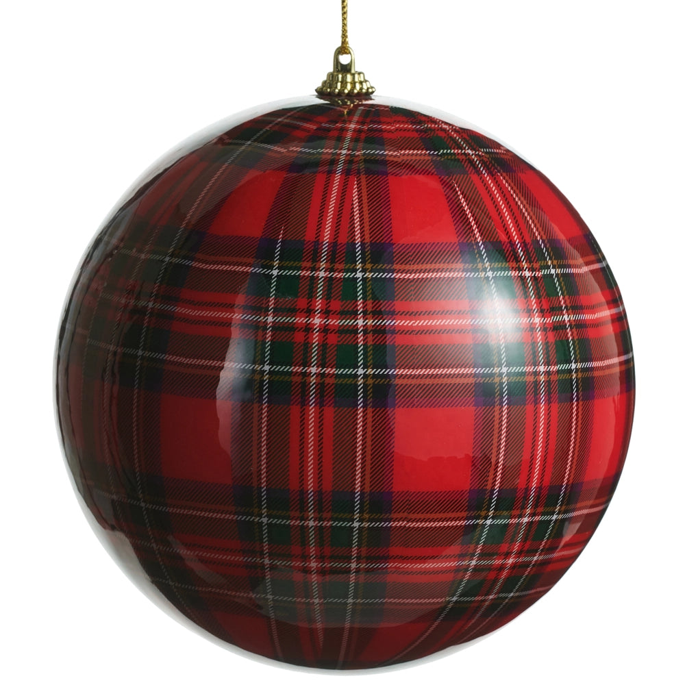 Red and black plaid Christmas ball ornament on a white background
