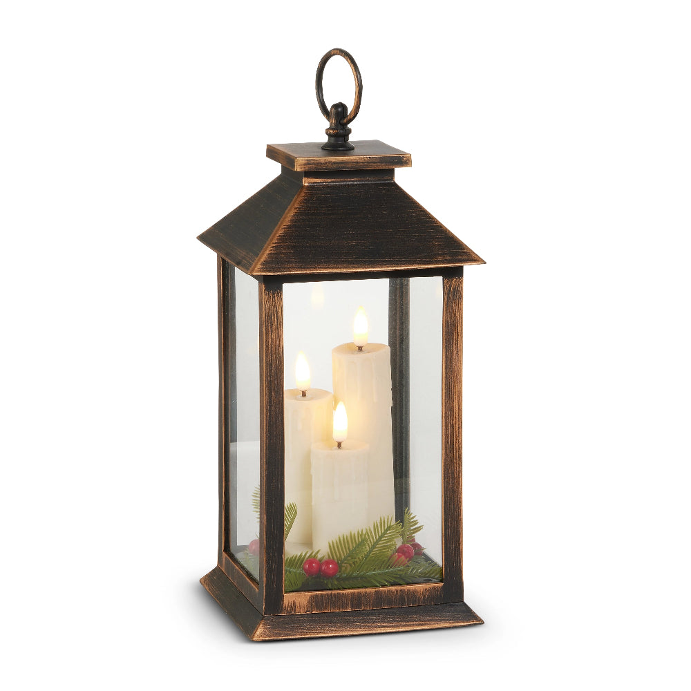 Decorative lantern with candles and greenery on a white background