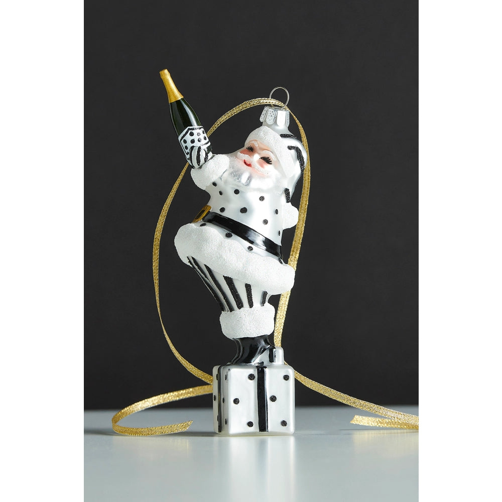 Decorative Christmas ornament of a stylized Santa Claus on a black background