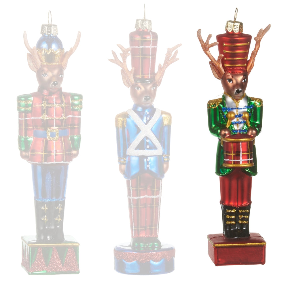 Green reindeer ornaments in Nutcracker costumes on a white background.