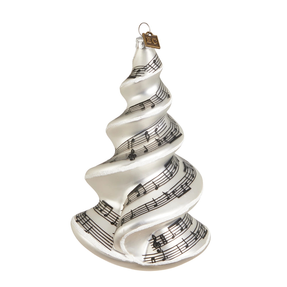 Decorative Christmas tree ornament with musical notes on a white background