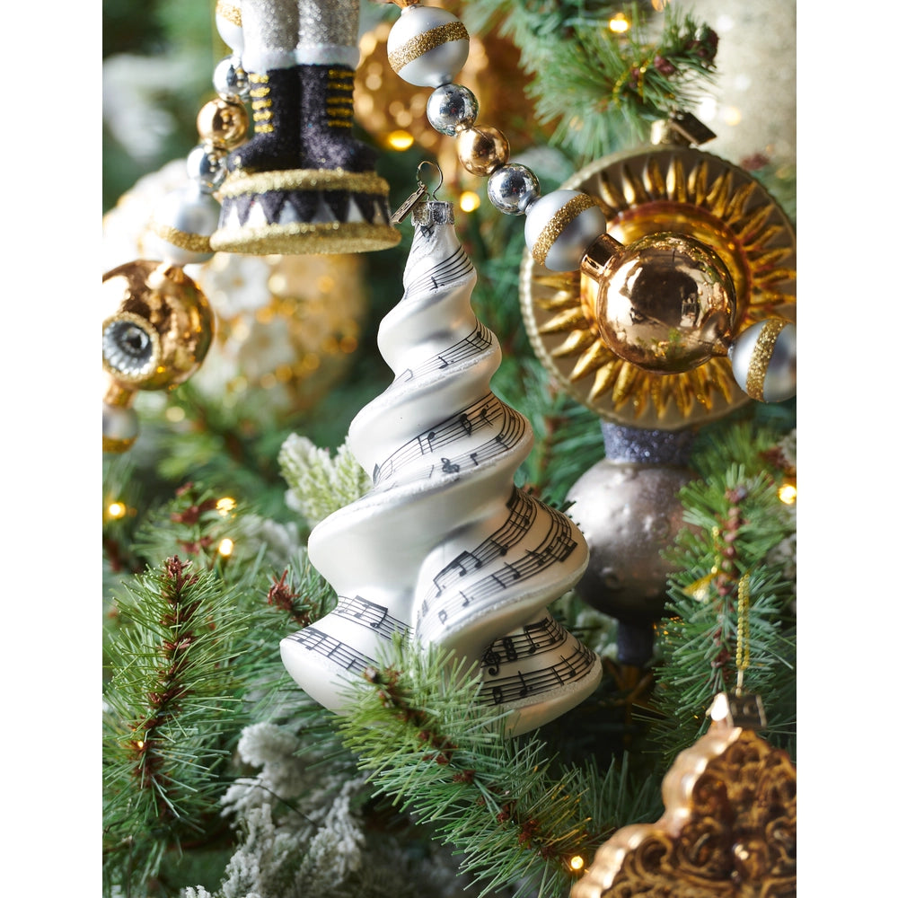 Decorative Christmas ornament with musical notes on a tree