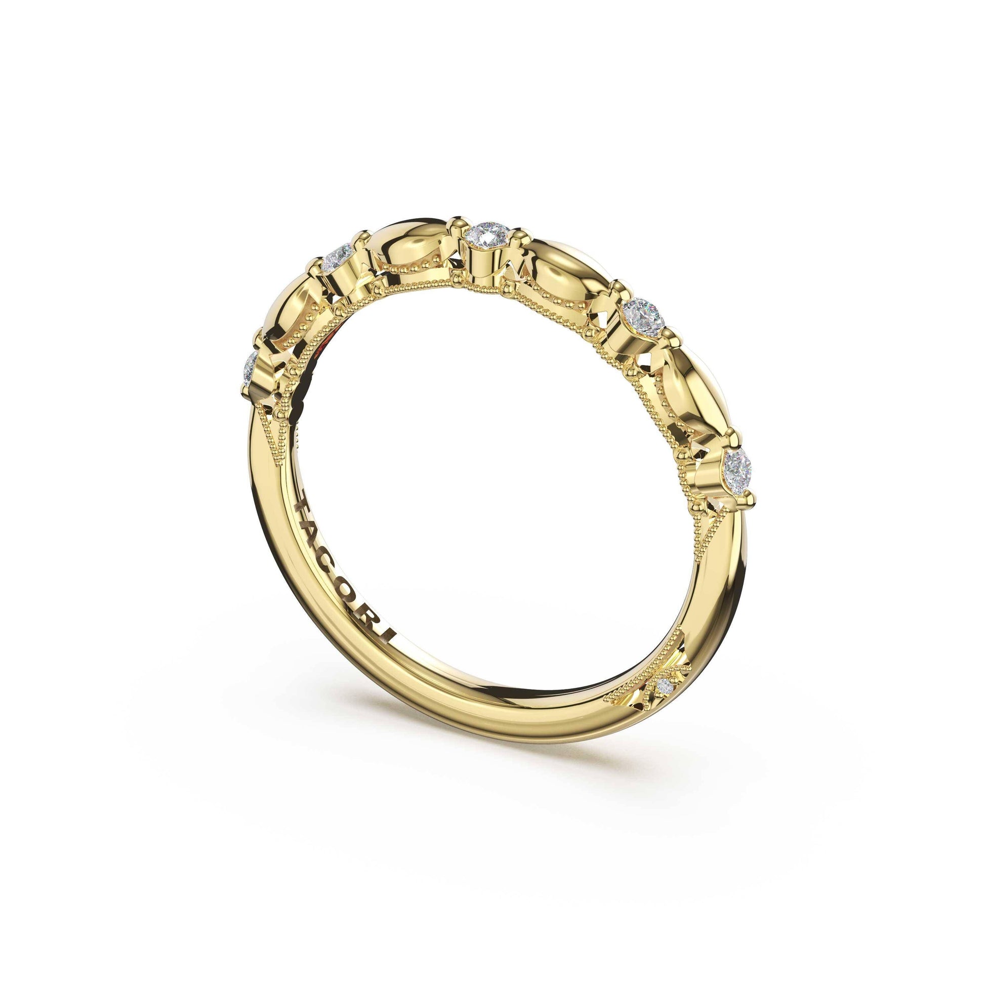 A yellow gold eternity ring featuring small round-cut clear gemstones set along the band, photographed on a clean white background.