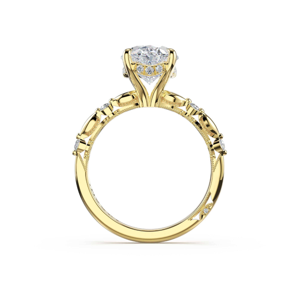 A yellow gold solitaire engagement ring with a round brilliant-cut diamond center stone and small accent diamonds along the shank, shown on a plain white background.