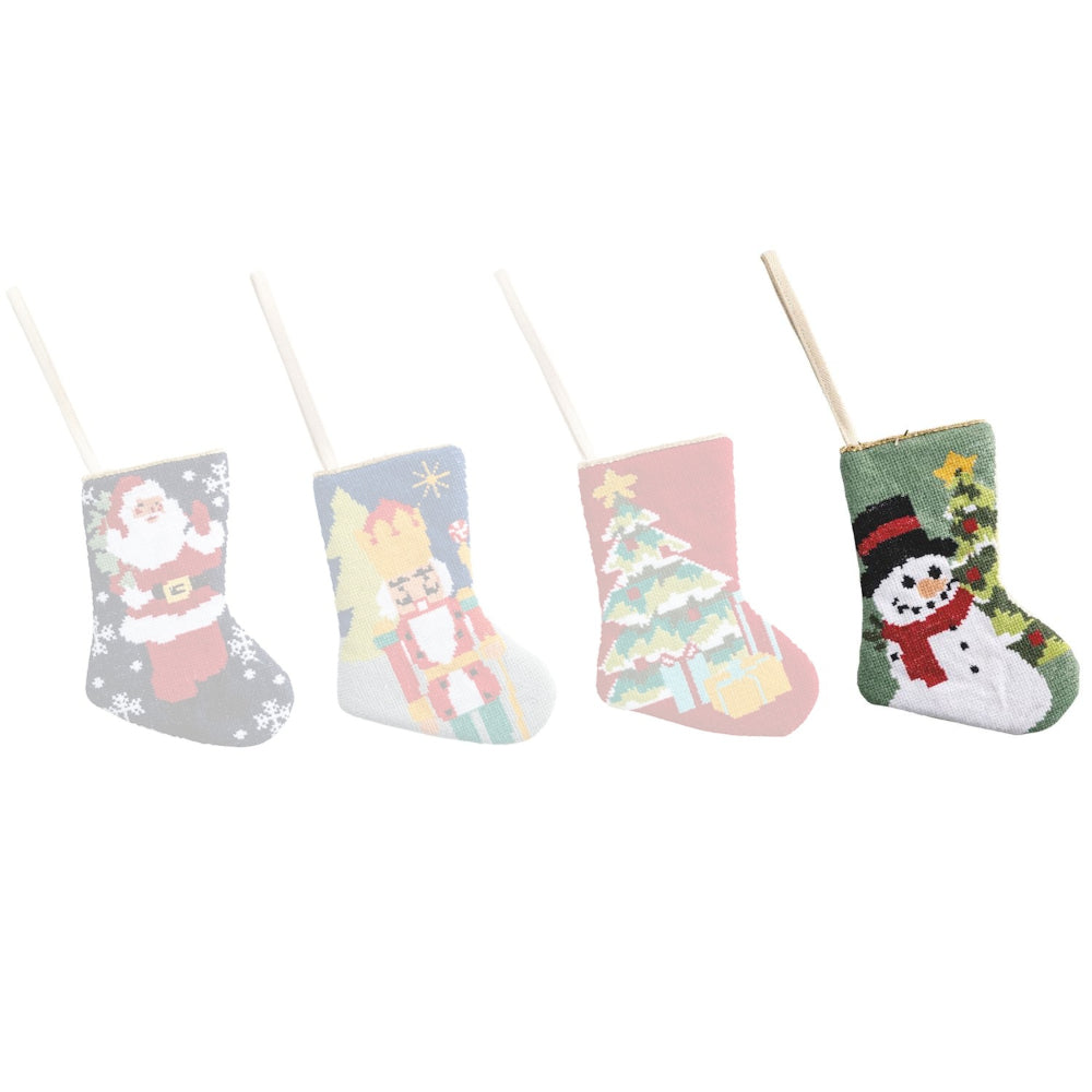 Set of four small Christmas stockings with festive designs on a white background