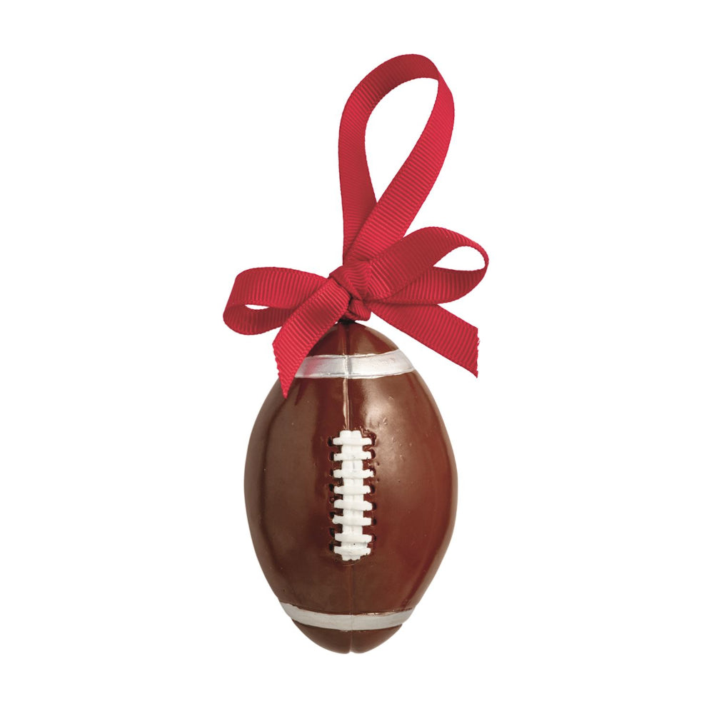 Decorative football ornament with a red ribbon on a white background