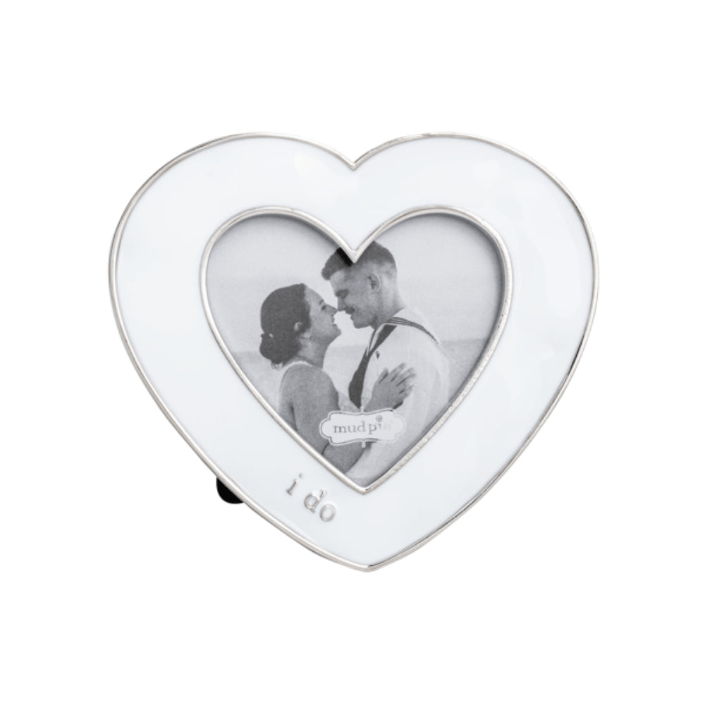 White heart-shaped photo frame with a couple picture and 'I do' text on a white background.