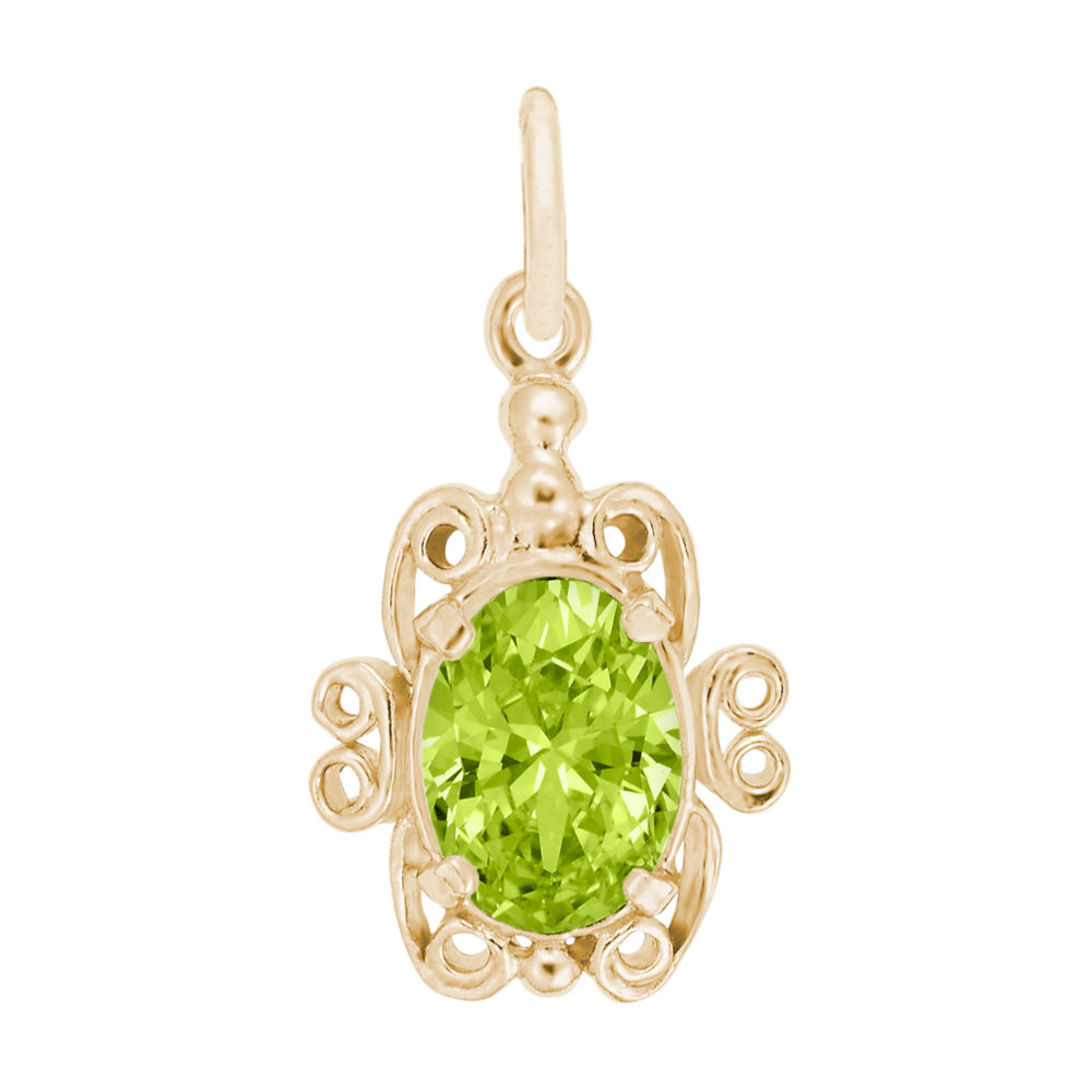 Gold pendant with a green gemstone on a white background