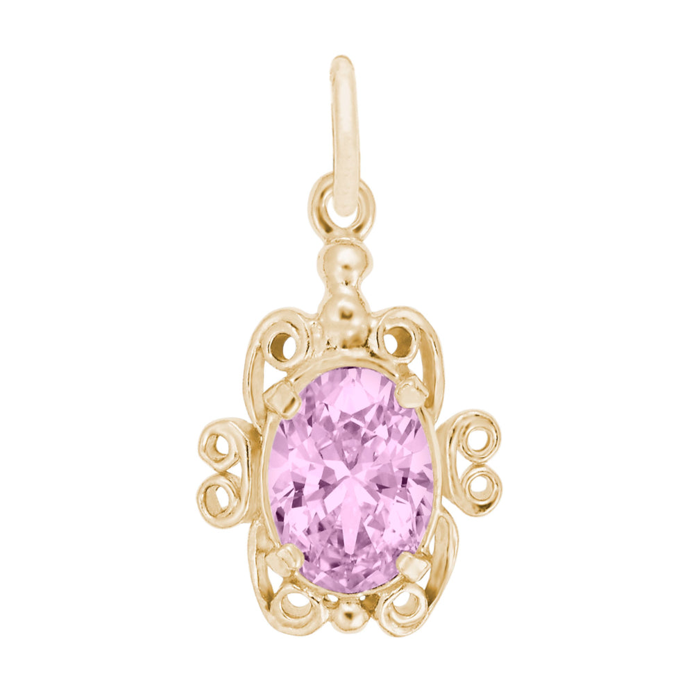 Gold pendant with a pink gemstone on a white background