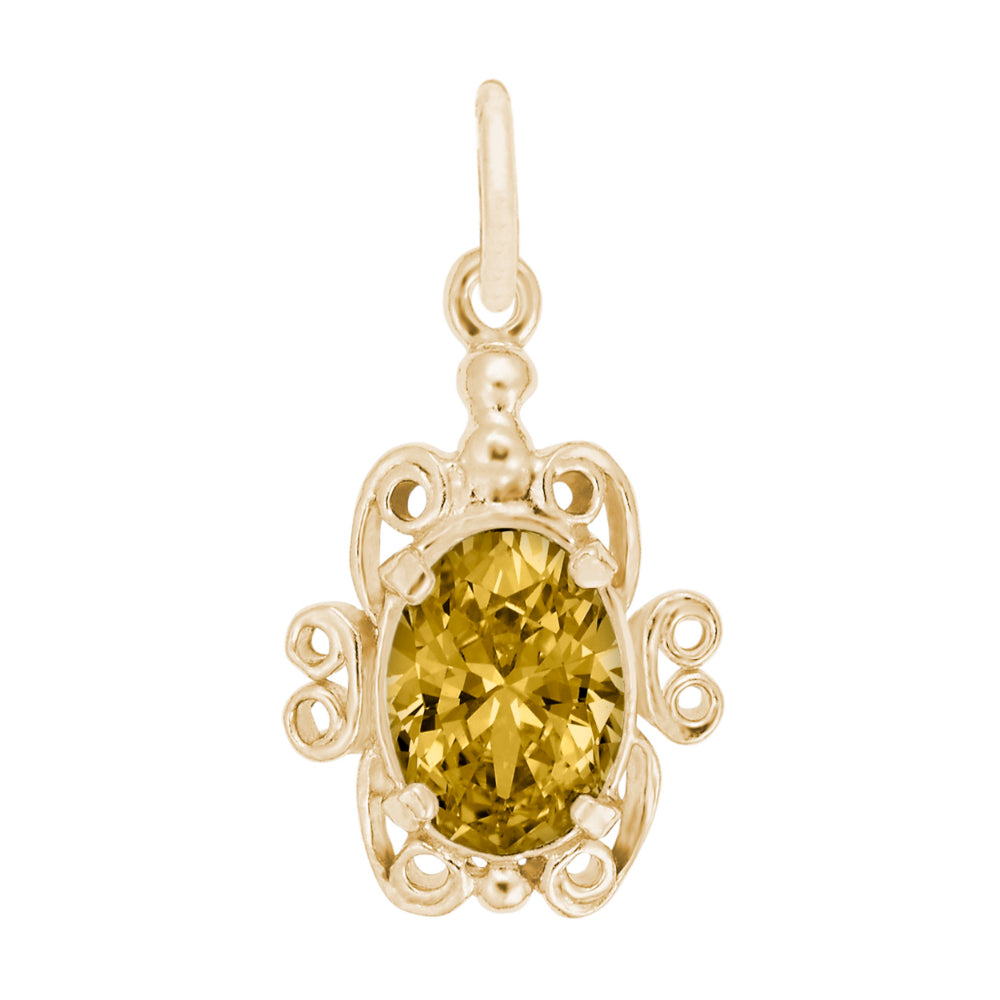 Gold pendant with a yellow gemstone on a white background