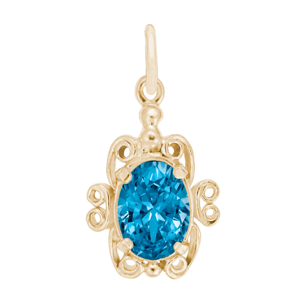 Gold pendant with a blue gemstone on a white background