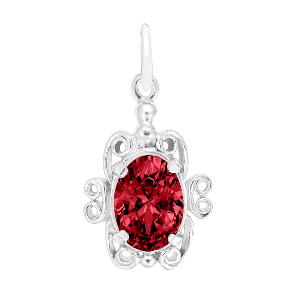 Silver pendant with a red gemstone on a white background