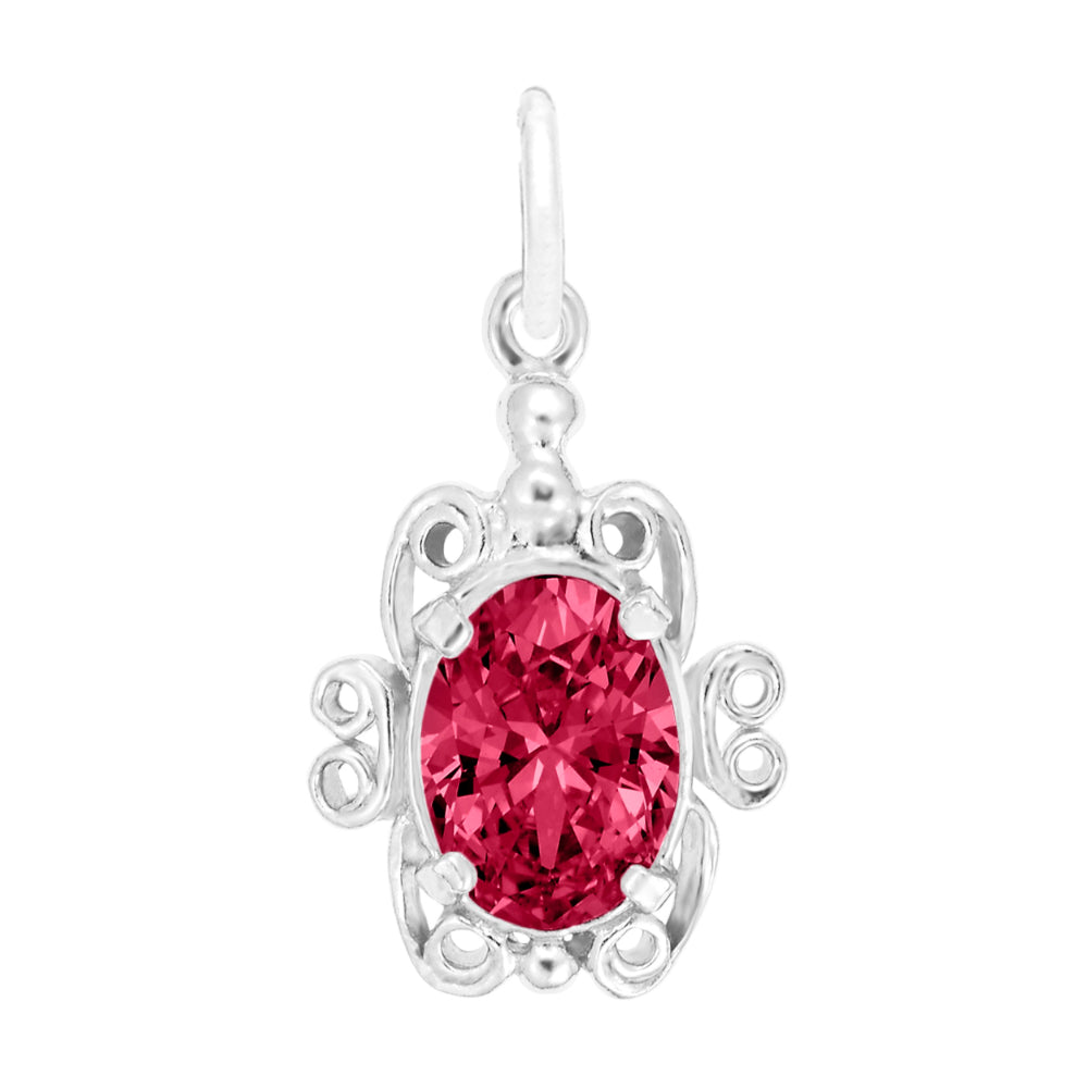 Silver pendant with a red gemstone on a white background