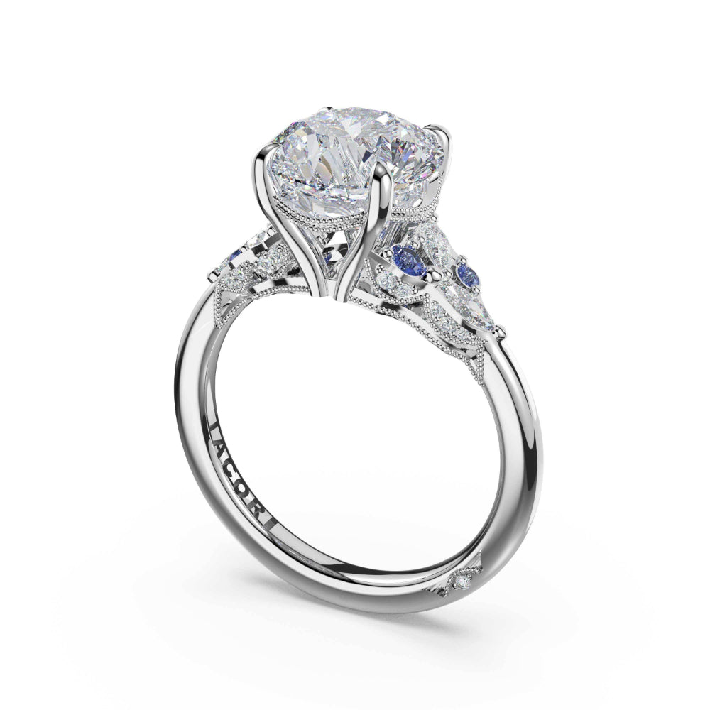 Diamond ring with a central gemstone and smaller stones on a white background