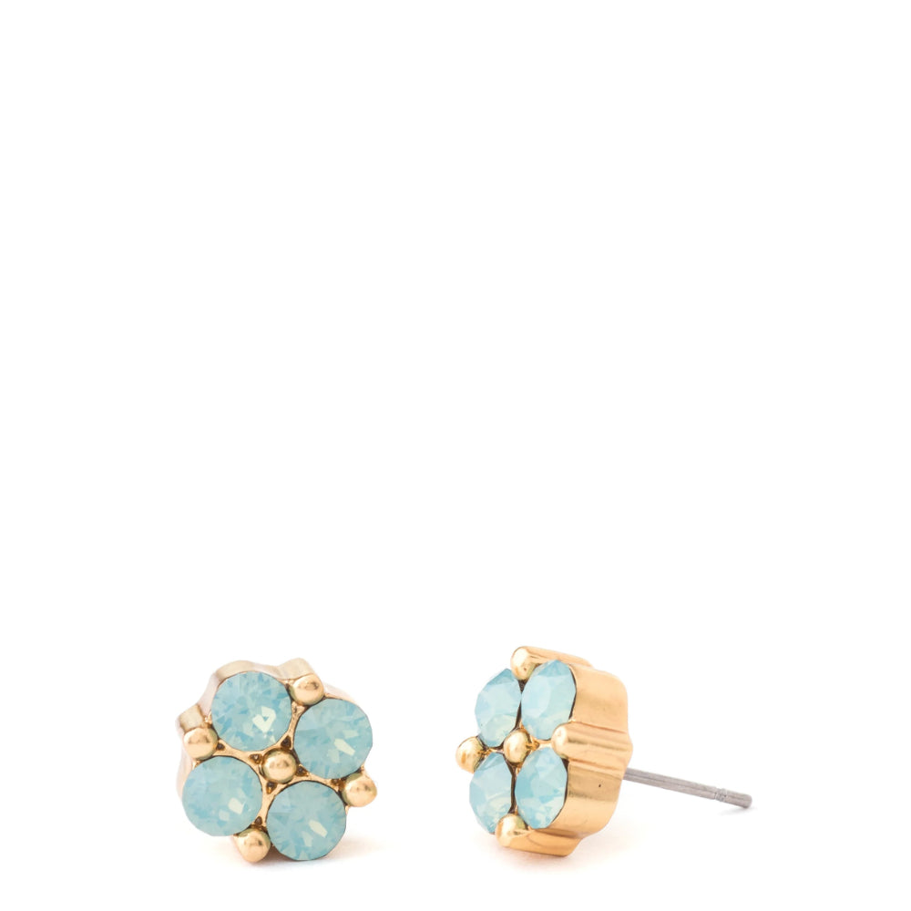Gold-tone clover shaped stud earring with sea foam green crystals against a white background.