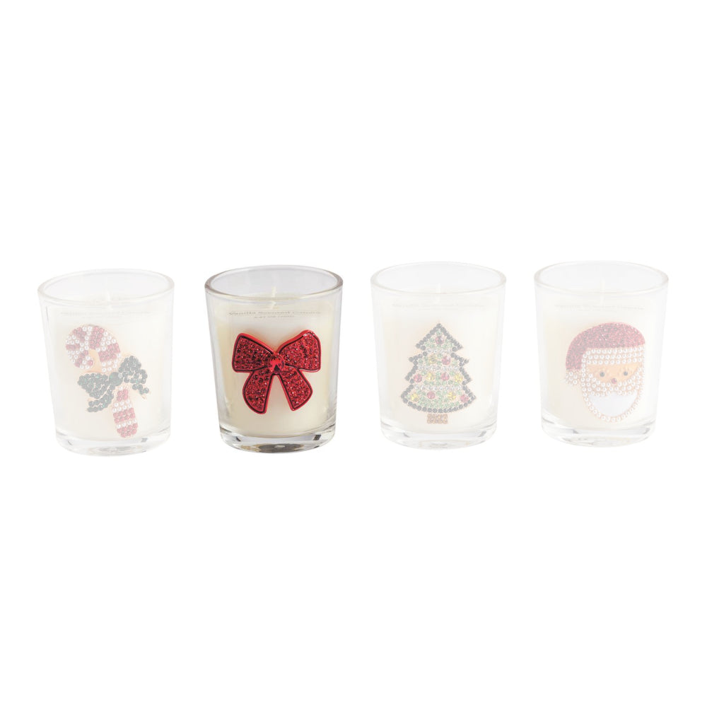 Four clear glass candle holders with white wax and festive holiday illustrations, including a candy cane, red bow, Christmas tree, and Santa face, arranged in a row on a white background.