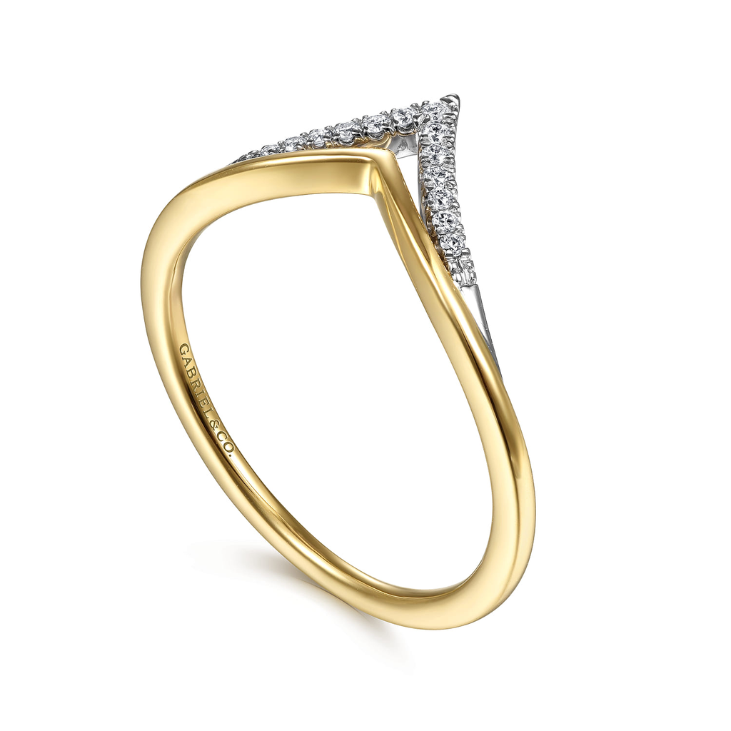 Gold ring with diamond accents on a white background
