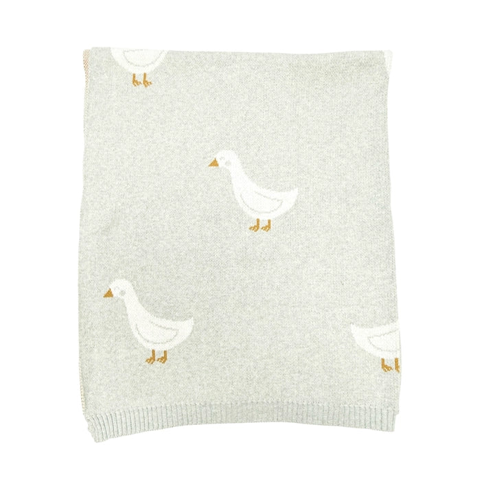 Light gray knit blanket with white duck designs on a white background