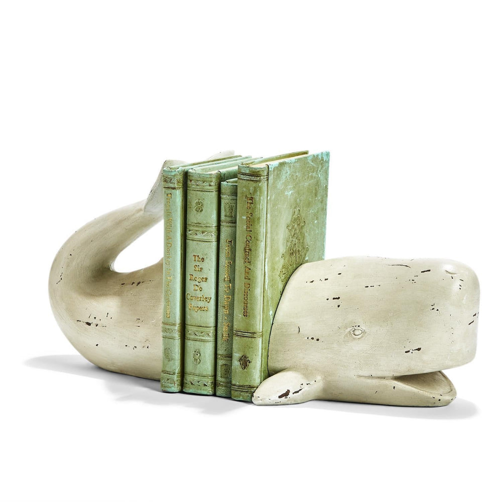 White whale-shaped bookend with a map design on a white background.