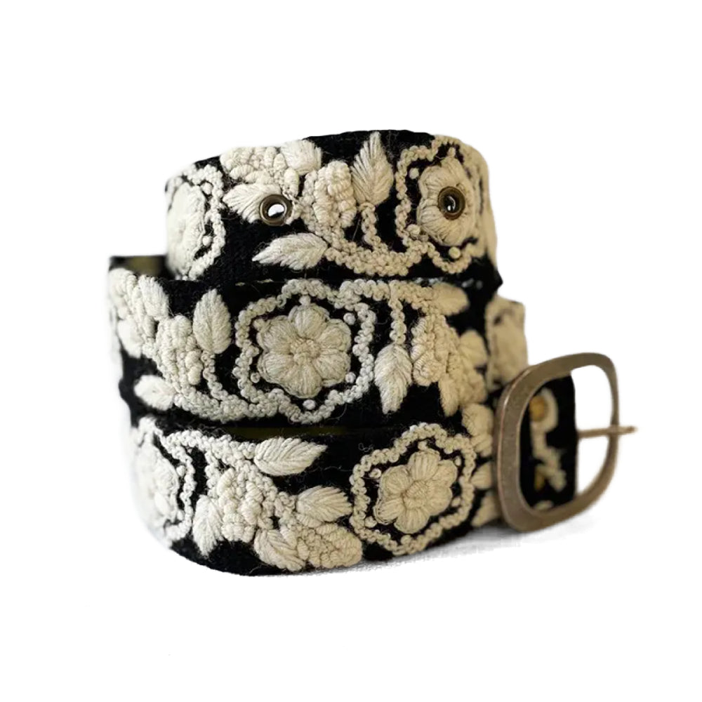 Black belt with white floral embroidery on a white background