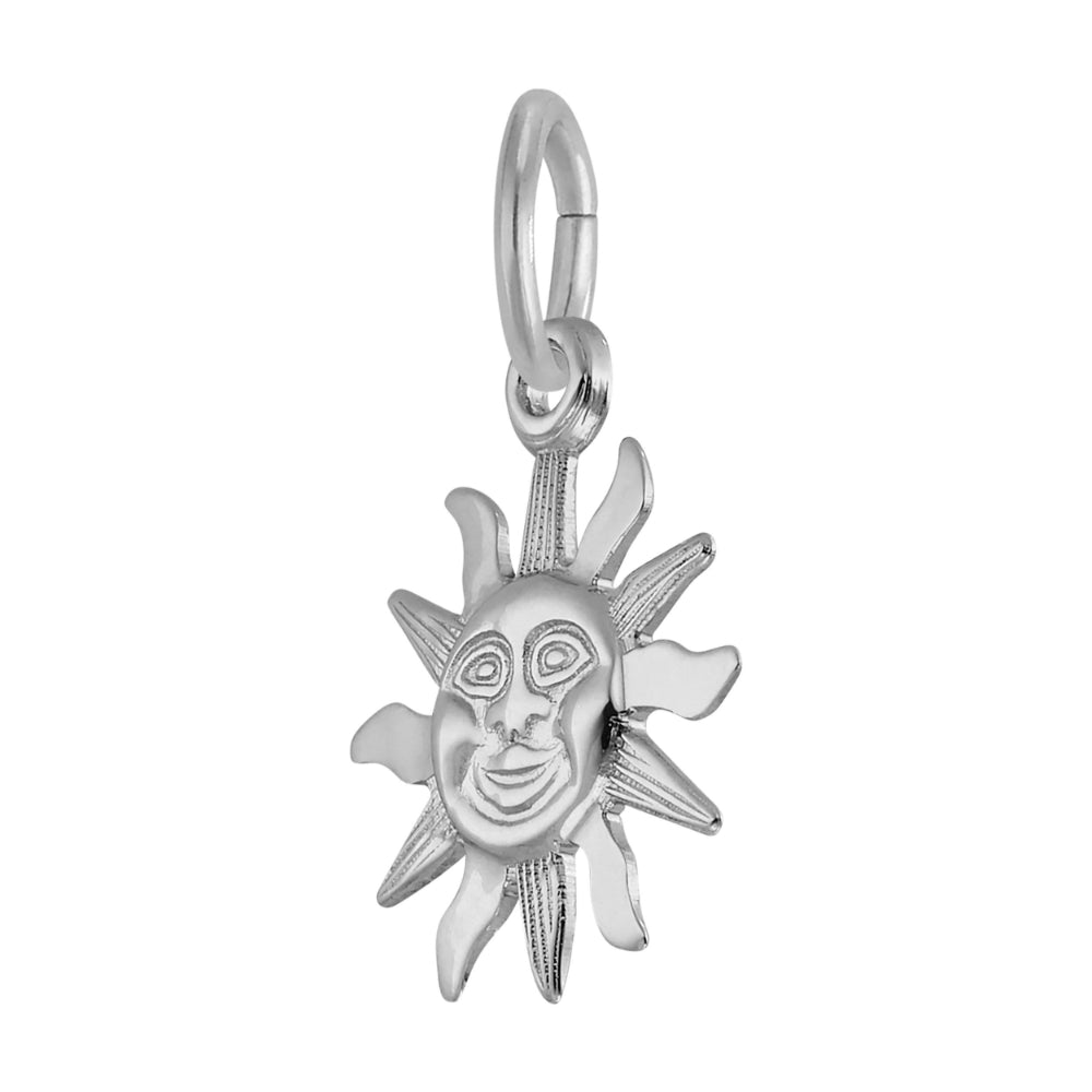Silver sun-shaped pendant with face design on a white background