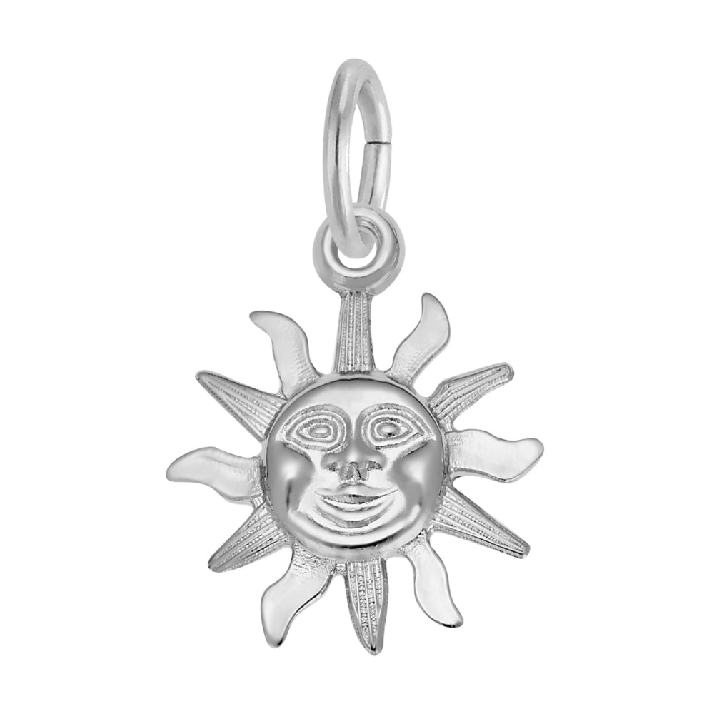 Silver sun pendant with face design on a white background