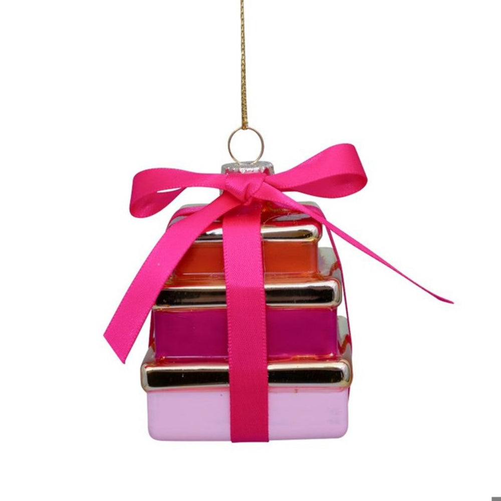 Decorative ornament shaped like a gift box with a pink ribbon on a white background
