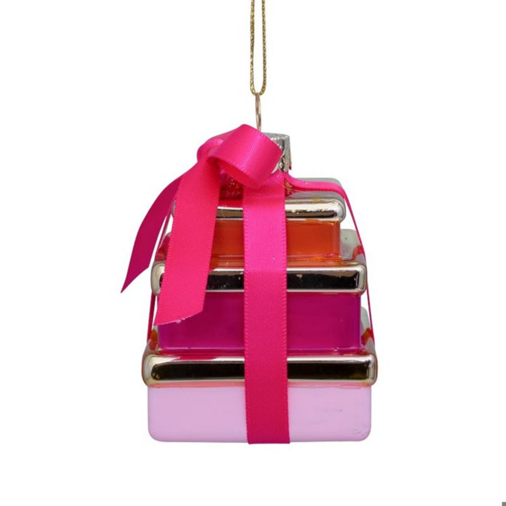 Pink gift box ornament with a gold ribbon on a white background