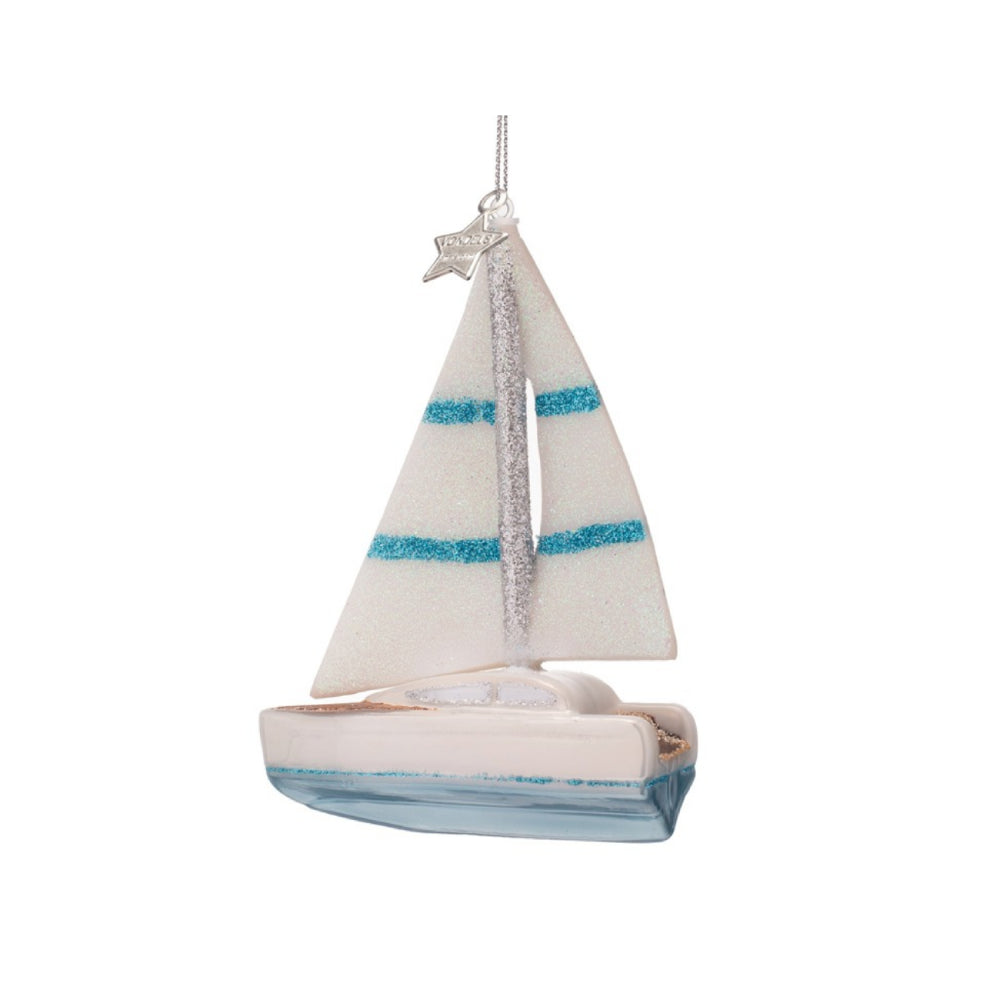 Decorative sailboat ornament with a white sail and blue stripes on a white background